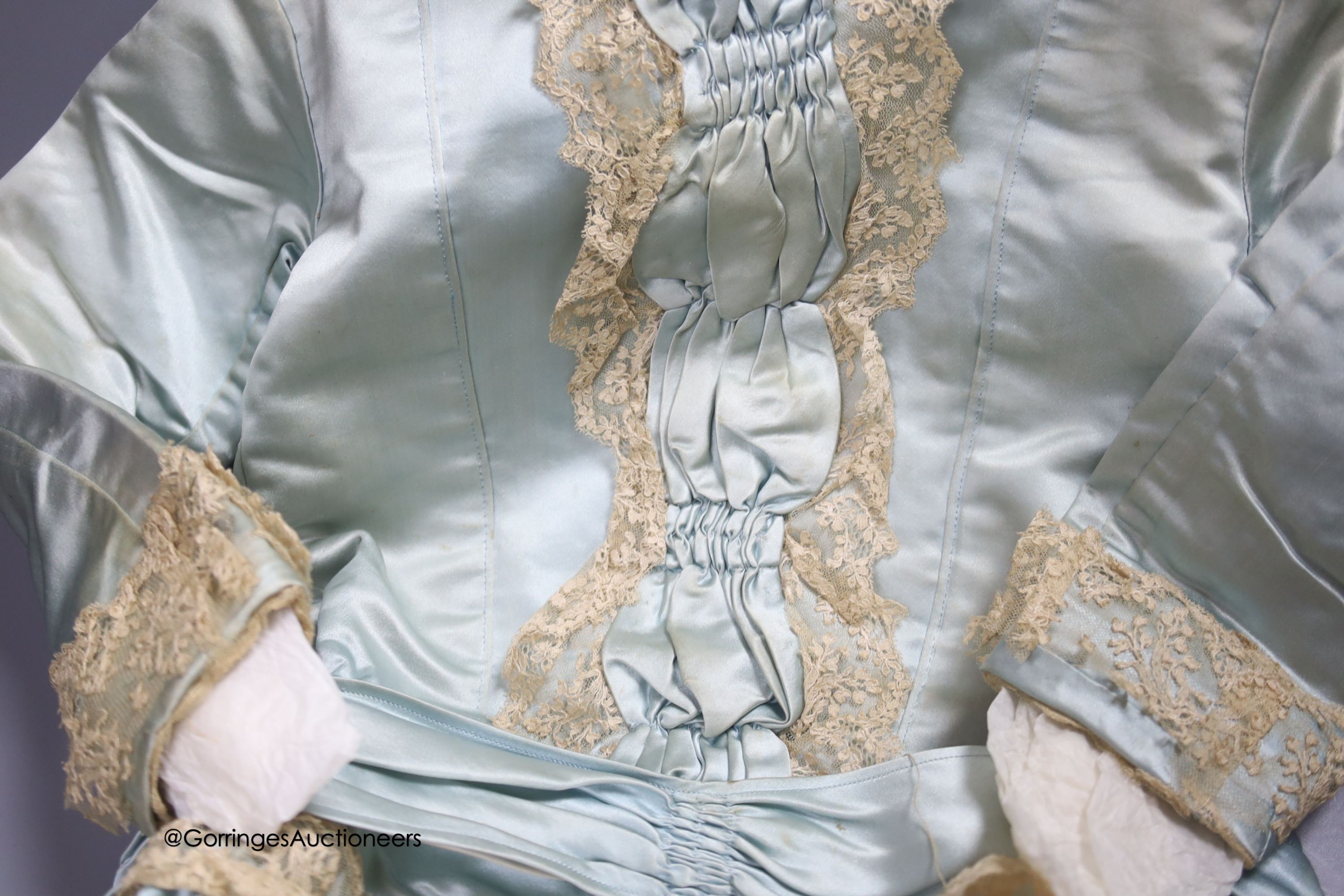 A Victorian silk and lace bordered dress